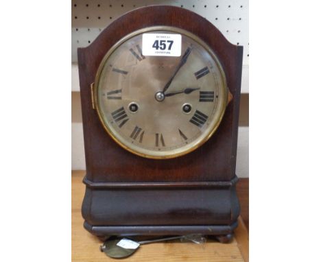 An early 20th Century stained walnut cased mantel clock with German eight day striking movement