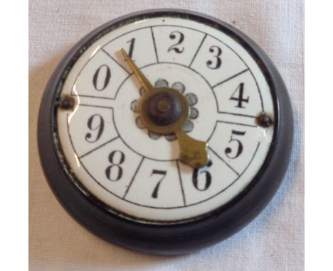 A antique enamel faced bridge or whist marker