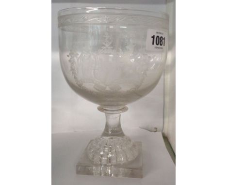 An early 19th Century oversized glass rummer on moulded lemon squeezer base, decorated with an engraved coat of arms for the 