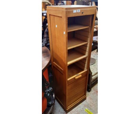 A 16 3/4" oak and mixed wood tambour fronted five shelf filing cabinet with panelled sides and key - slight damage to handle