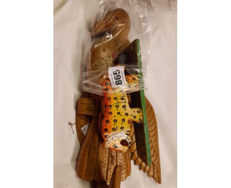 A novelty wooden bird hanger sold with a wooden leopard automaton toy
