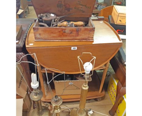 A 28" Ercol light elm drop-leaf two tier tea trolley, set of turned supports and Shepherd casters - some staining to top