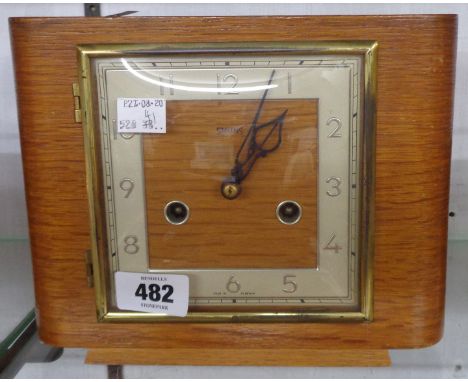 A mid 20th Century Smiths polished oak cased mantel clock with eight day gong striking movement - Bravingtons Ltd. label to d