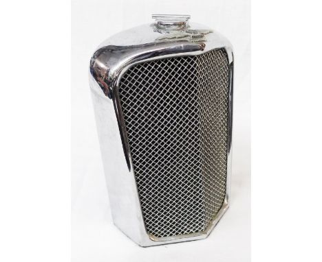 A vintage Ruddspeed chrome plate spirit flask in the form of a Jaguar SS car radiator