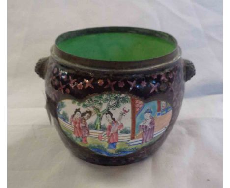 An old Cantonese brass and enamel bowl, decorated with panels depicting figural groups with a purple and green patterned grou