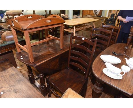 Large carved hardwood drop leaf dining table and six ladder back chairs