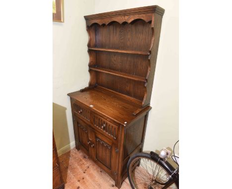 Oak shelf back dresser with linen fold panel doors