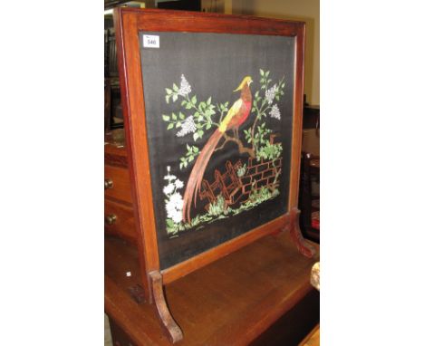 Early 20th Century oak framed tapestry firescreen depicting exotic bird amongst foliage. (B.P. 24% incl. VAT)