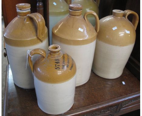 Four vintage stoneware two tone flagons, one marked 'The Swansea old brewery (Davies, Cardigan)', one marked 'Price, Bristol'