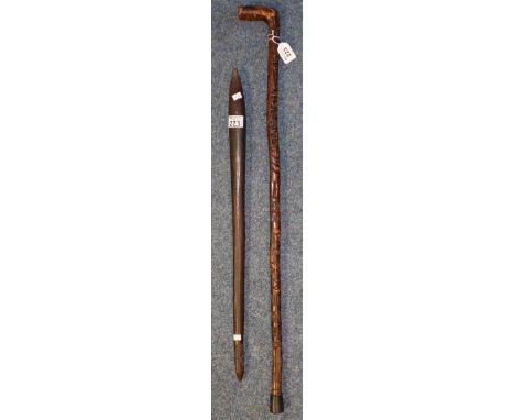 Rustic geometrically carved walking stick, together with a small probably South Seas ceremonial club of moulded ovoid form wi