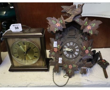 Oxidised brass Metamec bracket style clock, together with a wooden cuckoo clock. (2)(B.P. 24% incl. VAT)