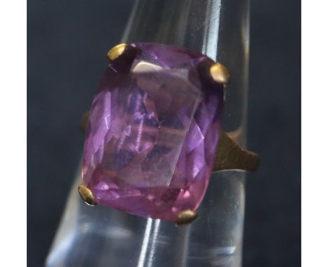 A 9ct and amethyst dress ring with large rectangular stone. 4.6g approx. (B.P. 24% incl. VAT)