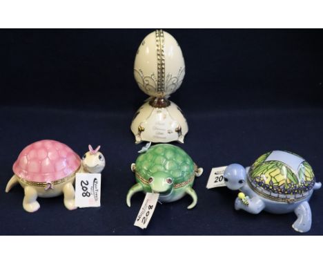 Three ceramic Ardleigh Elliott musical boxes in the form of turtles, together with another in the form of an egg. (4)(B.P. 24