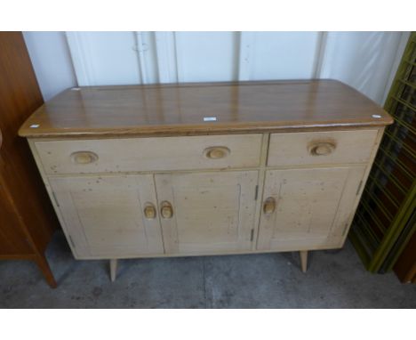 An Ercol Blonde elma and beech Windsor sideboard 