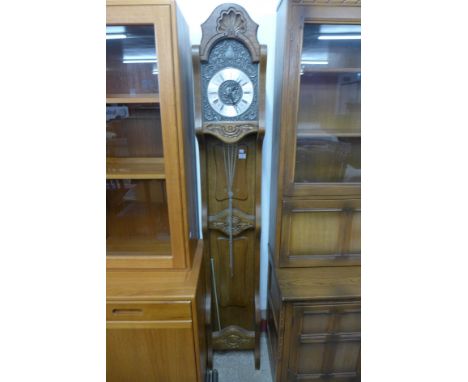 A French carved oak longcase clock 