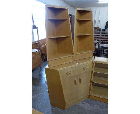 A G-Plan Brandon light oak fitted secretary corner cabinet and pair of matching corner shelves 