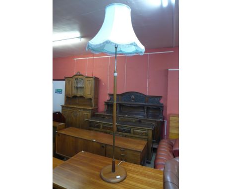 A teak standard lamp 