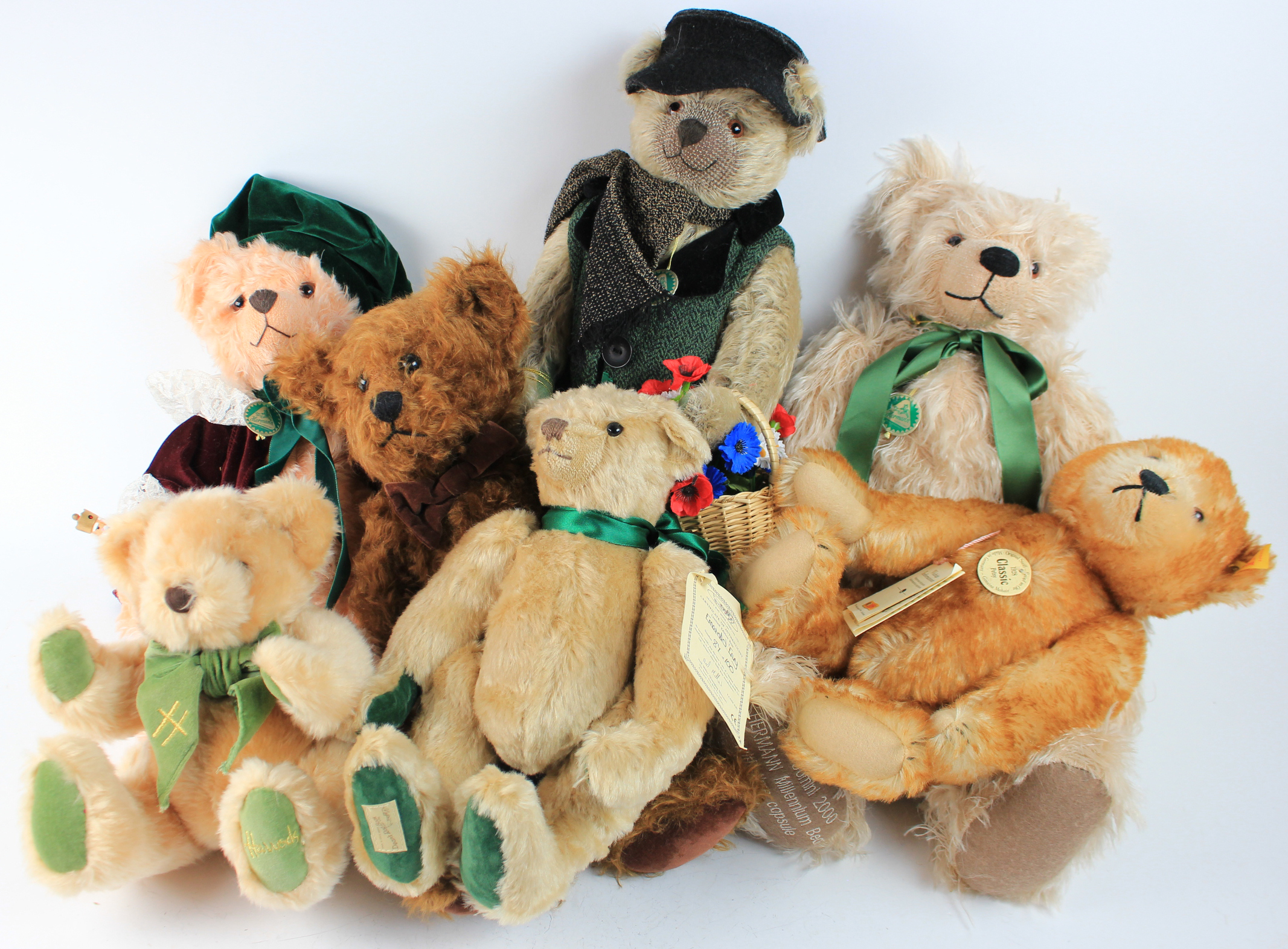 Teddy bears. A collection of seven teddy bears, makers comprise Steiff