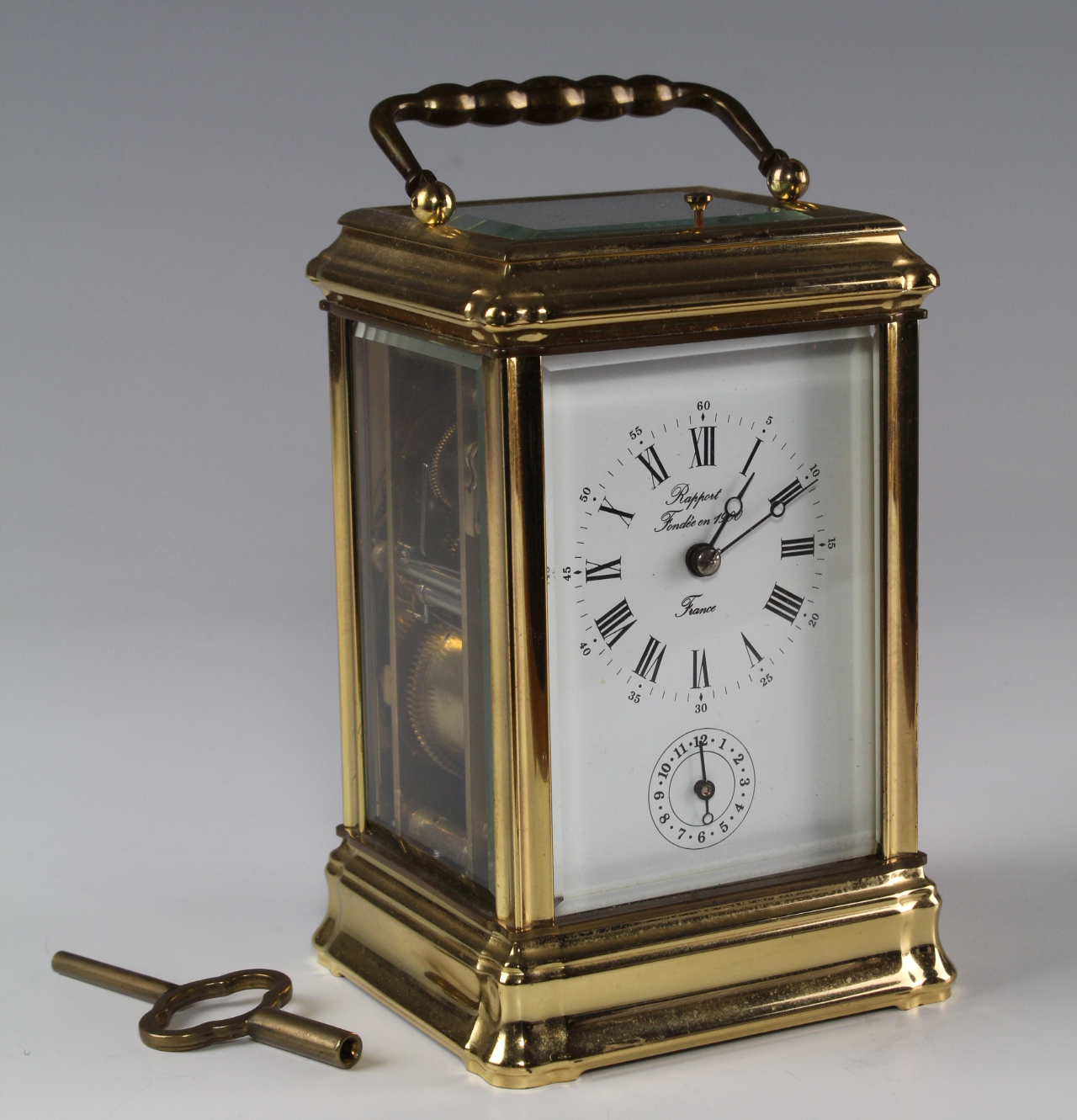 Brass five glass carriage clock by Rapport, with Roman numerals and