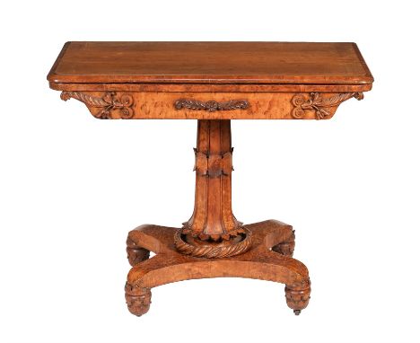 A George IV bird's-eye maple card table, circa 1825, in the manner of Gillows, the folding top enclosing a circular inset pla
