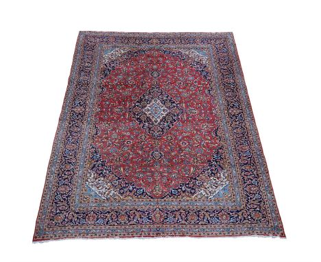 A Tabriz carpet, approximately 394 x 296cmCondition Report: Some wear but carpet maintains good pile overall. Binding of long