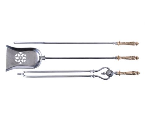 A set of late George III steel and brass fire tools, early 19th century, comprising a poker, shovel, and tongs, each implemen