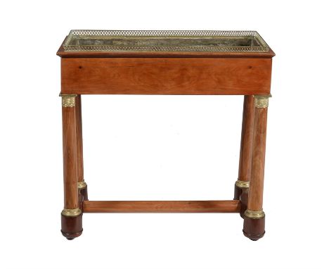 A Louis Philippe mahogany and gilt metal jardinière, circa 1850, the top with gallery around the aperture, on turned columnar