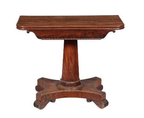 A George IV mahogany card table, circa 1830, the hinged top enclosing a baize playing surface, above a facetted stem, quadrip