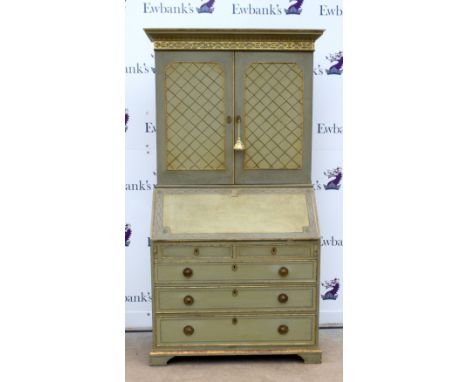 Early 20th century green and gilt painted oak bureau cabinet with shelves over fall flap with pigeon holes and drawers, over 