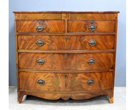 George III flame mahogany bow fronted chest of 2 short over 3 long drawers crossbanded top with ebony stringing on bracket fe