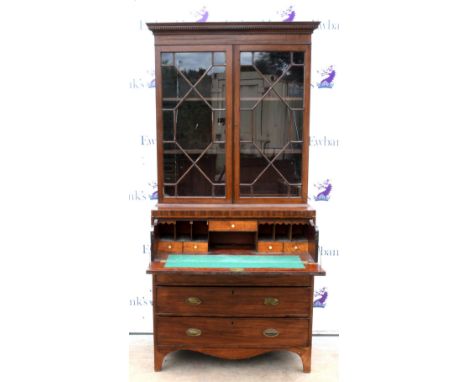 19th century mahogany secretaire bookcase, the dentil cornice above astragal glazed doors, secretaire revealing fitted interi