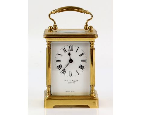 French brass carriage clock retailed by Mappin and Webb with corner column supports 11 cm high           