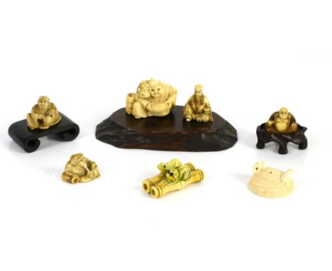 Collection of 6 Japanese netsukes, including two rats on a straw basket, signed 4cm dia, a seated figure with a mask, 4.75 cm