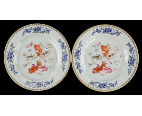 A pair of Chinese Export plates; each one decorated en-grisaille and in famille rose with five swimming fan-tailed gold fish;