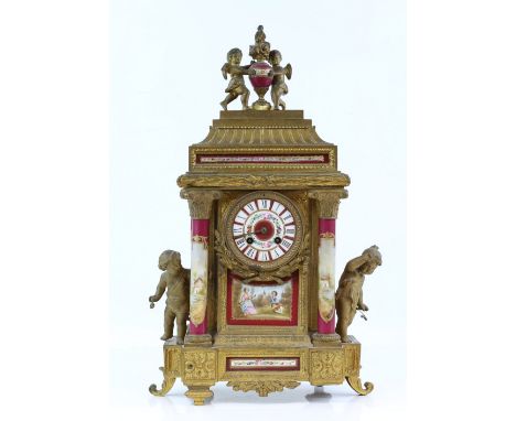 19th century French gilt metal mantel clock inset with red ground porcelain plaques decorated with flowers, two train movemen