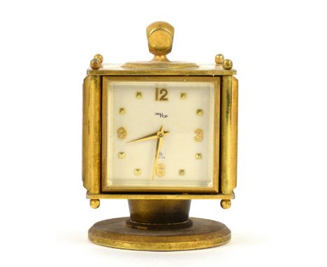 An ImHof desk compendium clock, thermometer, barometer, and hygrometer with brass effect case with bevelled glass panels, on 