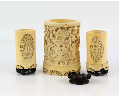 Late 19th century / early 20th century Chinese ivory tusk vase deeply carved with figures in a terraced garden, 14cm high tog