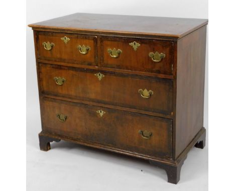 An 18thC walnut chest, of two short and two long drawers, each with a wide crossbanding, on bracket feet, partially inlaid to