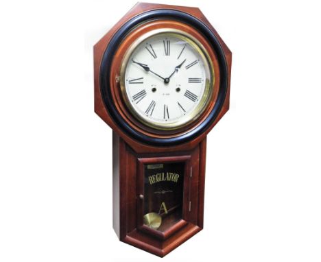 An American wall clock, in octagonal case, with drop section fronted by a glass door, with 23cm Dia. Roman numeric dial marke