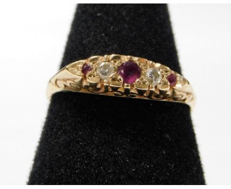 A 9ct gold marquise ring, set with three garnet stones and two cz stones, with raised scroll decoration, ring size R, 2.7g al