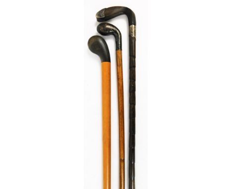 A very early 20thC walking stick,  with plain stem and golf club horn top and tip, a walking cane with silver collar and tip 