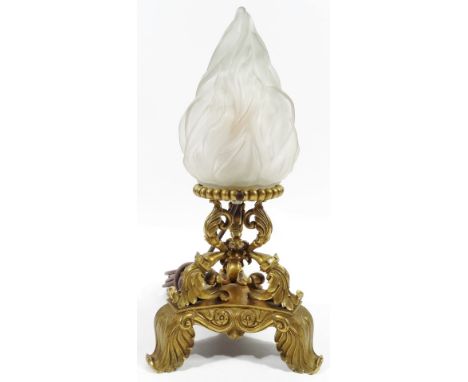 A 19thC French triform table lamp, with frosted glass flame shade, on triple acanthus supports terminating in a tricorn base 