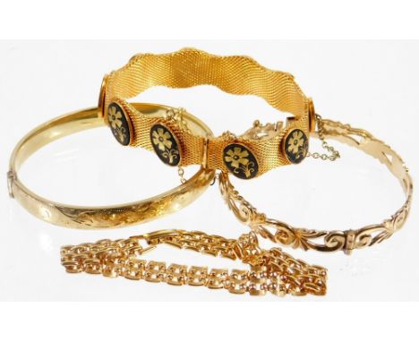 Four costume jewellery bracelets, comprising a rolled gold hinged bangle with engraved design, a gold plated wave design brac