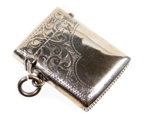 An Edwardian silver vesta case, of rectangular form partially etched with scrolls, with ring side, and match strike base, Bir