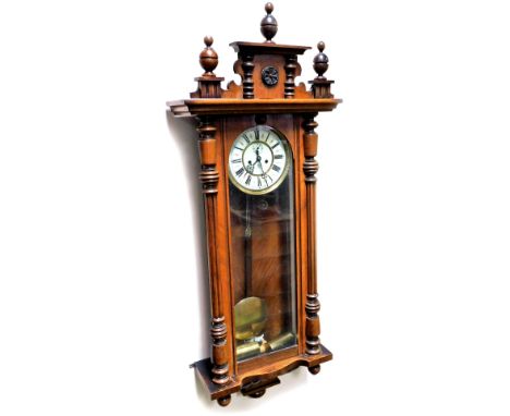 A late 19thC Gustav Becker walnut cased Vienna wall clock, of rectangular form, with urn and sun patera finial, quarter colum