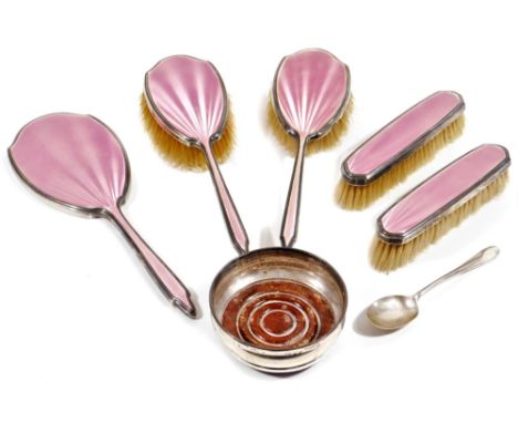 A George VI silver and pink enamel dressing table set, comprising of hairbrush, 24cm W, another, two clothes brushes and hand