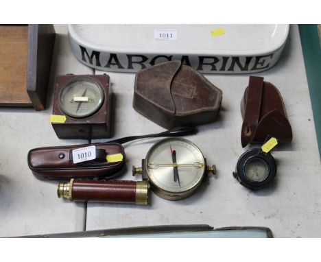 An A. Kirshaw & Sons Ltd. gauge; Elliott Bros of London compass; a telescope and a T.G. Co. Ltd. of London compass dated 1942
