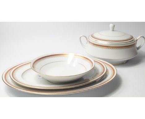 A Noritake porcelain part dinner service decorated in the Doral Maroon pattern, comprising seven meat platters, three vegetab