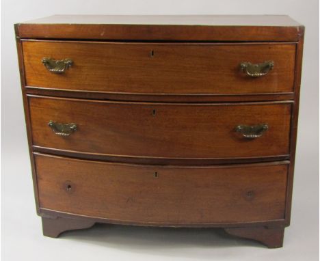 A George III mahogany bow front chest of three drawers, raised on bracket feet, 90cm x 46.5cm x 77cm.