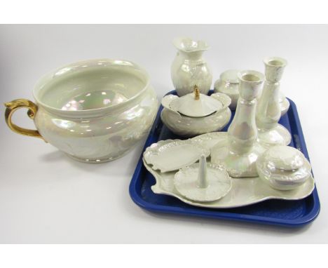 A Shelley Porcelain pearl lustre dressing table set, comprising three jars and covers, a pair of candlesticks, dish, ring tre